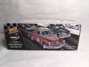 lot 2602 image: Ertl Collectibles WIX Filters 1949 Oldsmobile Rocket 88 NASCAR Die-Cast Bank with Commemorative Coin