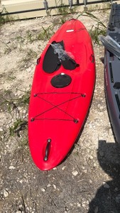 lot 613 image: Red unused Kayak with Paddle and Spray Skirt