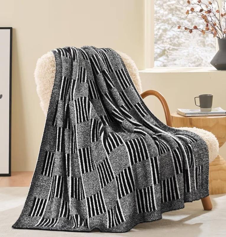 lot 37603 image: Snuggle Sac Checkered Throw Blanket, Black Fluffy Faux Fur Reversible Soft Microfiber Warm Throw Blankets for Couch, Sofa, Travel, Cozy Lightweight Striped Blankets for Women, Heather Black,50x60 inches - Retail $40
