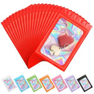 lot 43138 image: ANZNKU 100 Pieces Smell Proof Mylar Bags, Holographic Packaging Goodie Bags Odor Foil Pouch Zipper Bag with Clear Window for Food Storage Candy Lipgloss, Jewelry Lash (Red, 2.4 x 3.9 Inch) - Retail $7