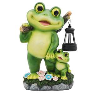 lot 9380 image: CFFOWNUG Outdoor Frog Garden Decor 10 Yard Decoration with LED Lantern Funny Solar Parent-Child Frog Statue Gifts for Women Gardener Housewarming Gift - Retail $30