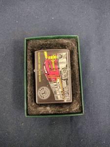 lot 62066 image: Zippo lighter American Legend series featuring a Lionel Santa Fe F3 Diesel Locomotive
