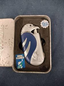 lot 62067 image: TurboBlue vintage eagle-themed lighter