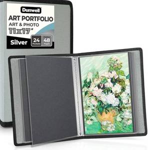 lot 63441 image: 11x17 Art Portfolio Binder with Black Mounting Paper (Silver), Large Portfolio Folder for Artwork Storage, 24 Clear Plastic Sleeves, Displays 48 Pages, Acid-Free Poly 11 x 17 Presentation Book - Retail $19