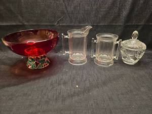 lot 50846 image: Red Glass Holiday Bowl with Enamel Holly Base and Clear Glass Serveware Set