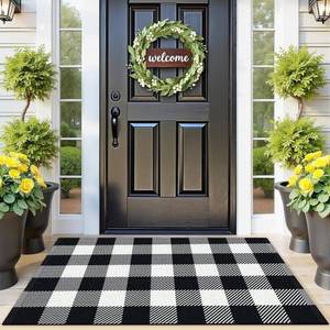 lot 9 image: Area Rug 24 x 37 Black &amp White Checkered Cotton Woven Welcome Mat