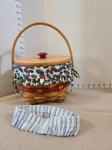 lot 1015 image: Longaberger basket has wood lid and handles with fabric and plastic liners, 1994 signed
