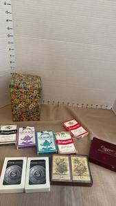 lot 1165 image: Playing cards and tin