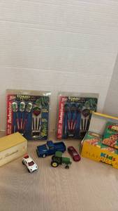 lot 1184 image: Darts, dominos, lion king playing cards and toy cars