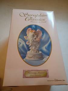 lot 1303 image: Seraphim Classics Heaven on Earth Figurines    Harmony Musical, Loves Guardian