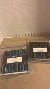 lot 2112 image: Robert Kaufman Charm Square Fabric Packs - Set of 2