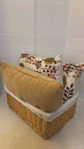 lot 7017 image: Decorative Throw Pillows with Wicker Storage Basket