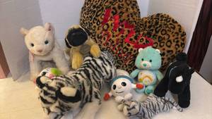 lot 7050 image: Mixed Plush Stuffed Animal Lot with Care Bear, Yomiko Classics Pug, Zebras, and More