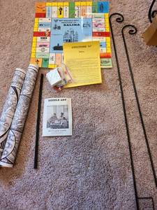 lot 7121 image: Salina monopoly game, doodle art, two garden hooks.