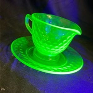 lot 802 image: Uranium Glass Cup and Saucer Set with Hobnail Pattern