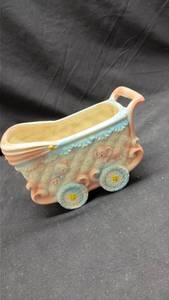 lot 857 image: Ceramic Baby Wagon Planter