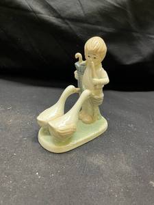 lot 950 image: Porcelain Boy with Geese and Umbrella Figurine