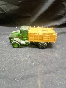 lot 988 image: Avon Big Mack Truck Green Glass After Shave Bottle Decanter