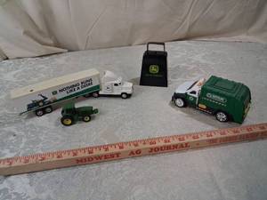 lot 2 image: John Deere Die Cast Vehicle Collection with Recycling Truck and Carry Case and John deer cow bell
