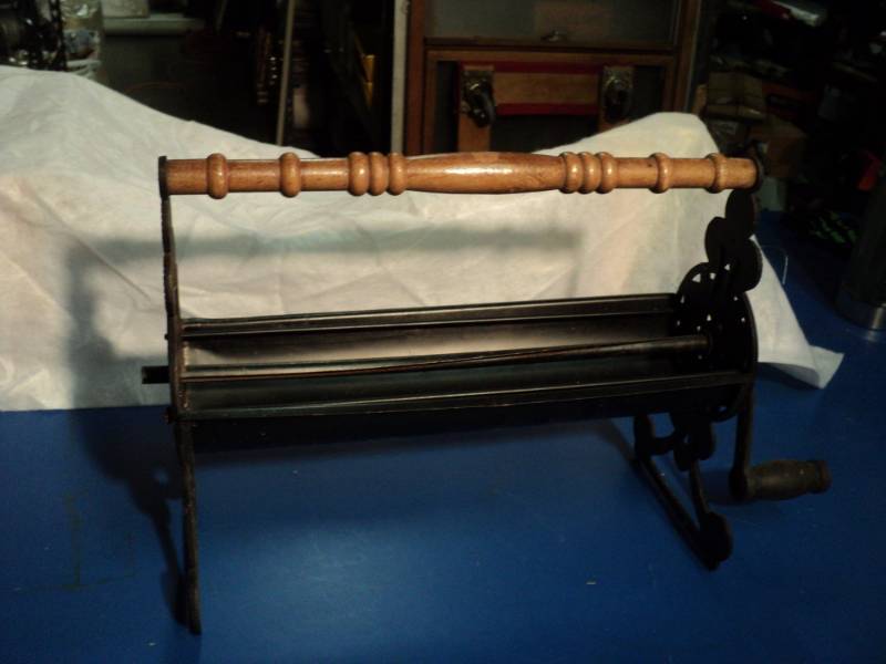 lot 4418 image: Vintage Fireside Paper Log Roller, metal with wooden handle