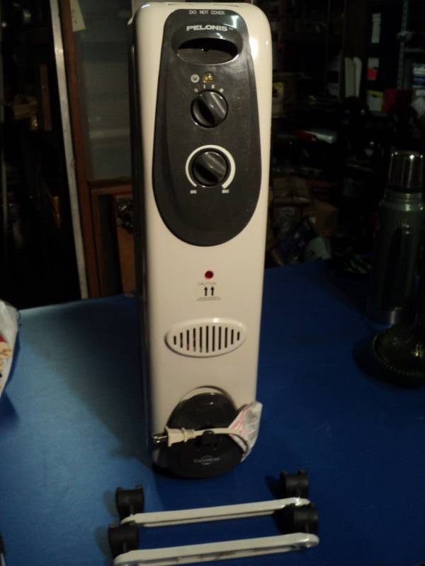 lot 4471 image: Pelonis Electric Radiator, Casters are not installed, used, untested