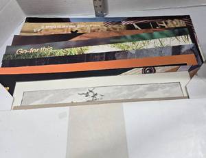 lot 509 image: Envelope of Posters.  Most are 22 x 14 - Retail $0