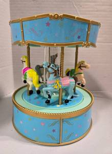 lot 514 image: Musical Carousel Music Box with Rotating Horses-plays several different Lullabies.