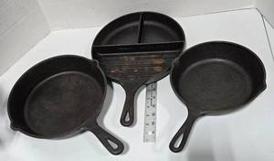 lot 562 image: Cast Iron Skillets. Lodge & Jim Beam Brands