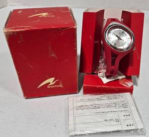 lot 620 image: Soma analog watch featuring a red silicone band and silver dial with red accents. Will need battery