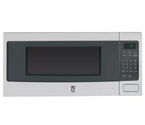lot 5 image: GE Microwave Oven with Digital Controls - Retail $520