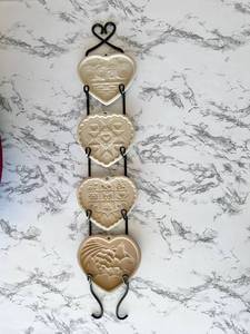 lot 133 image: Vintage Pampered Chef 4-Piece Stoneware Cookie Molds with Display Hanger