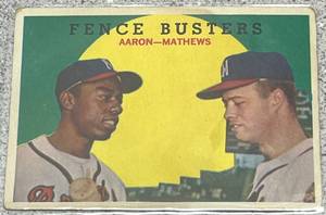 lot 101 image: 1959 Topps Baseball Card #212 - Fence Busters Hank Aaron & Eddie Mathews