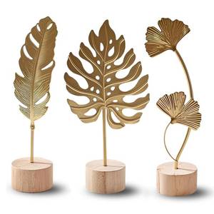lot 28174 image: Abirdflyer Gold Leaf Home Decor Set Metal Leaf Tabletop Ornament with Wood Base, 3 Designs (Monstera, Ginkgo, Feather) for Desk, Shelf, Living Room - Retail $9