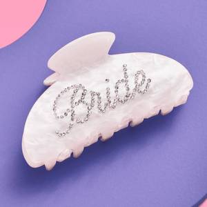 lot 18393 image: Xo Fetti Bride Claw Clip, White Acrylic Hair Clip, Rhinestone Bride Logo  Bachelorette Party Decorations, Bridesmaid Gift, Bridal Shower, Wedding - Retail $15