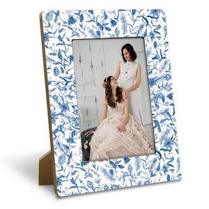 lot 18578 image: Yxadu Rustic Wooden Picture Frame 4x6 Inch, Blue & White Artistic Frame, Elegant Home Decor, for Bedroom & Living Room, Farmhouse Office Desk Decor, Gift for Teacher, Friends, Art Lovers - Retail $10