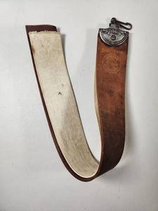 lot 94 image: Illinois Razor Strop Co. Barbers Special Genuine Horsehide Razor Strop No. 9263