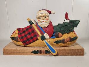 lot 175 image: Hand-Carved Wood Santa in Canoe Folk Art Sculpture