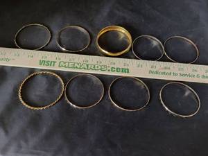 lot 56 image: Set of 8 Mixed Metal Bangle Bracelets