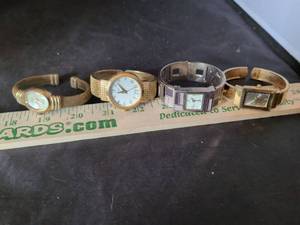 lot 87 image: Lot of 4 Womens Bracelet Watches Gold Tone and Silver Tone
