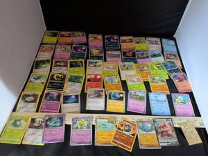lot 88 image: Pokemon TCG Mixed Card Lot - 50 Cards Including Holos and V Cards