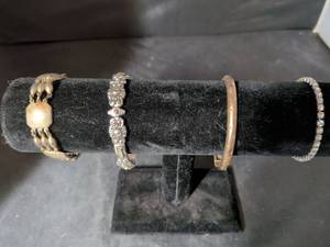 lot 104 image: Lot of 4 Silver-Tone and Gold-Tone Bracelets