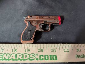 lot 135 image: Ji Guang Deng Miniature Pistol Shaped Lighter