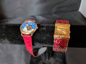 lot 177 image: Lot of 2 Ladies Novelty Quartz Watches - Christmas Dogs & Red Enamel Cuff