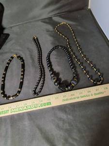 lot 211 image: Black and Gold Beaded Necklace and Bracelet Set - Lot of 4