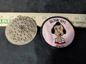 lot 239 image: Olive Oyl Embroidered Patch and Zodiac Medallion Pendant Set