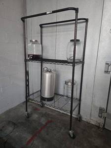 lot 12588 image: Rolling Wire Shelving Unit with Beverage Dispensers and Stainless Keg