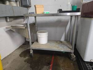 lot 12623 image: Stainless Steel Commercial Work Table with Casters and Undershelf