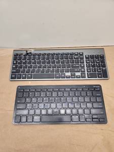 lot 15 image: Lot of 2 Wireless Keyboards - Full Size and Targus Bluetooth Compact