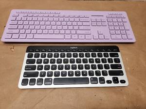 lot 16 image: Logitech Bluetooth Easy-Switch Keyboard K811 and Lavender Full-Size Wireless Keyboard Bundle