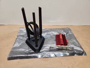lot 48 image: ASUS PCE-AX58BT WiFi 6 PCIe Adapter with Magnetic Antenna Base